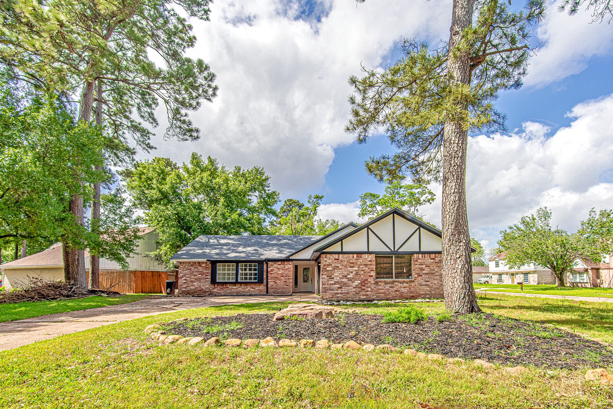 17811 Hawk Haven Lane Spring, TX 77379 - Photo 4 of 22 Charming single-story home nestled in a quiet cul-de-sac, featuring a spacious front yard with mature trees and a welcoming curb appeal.