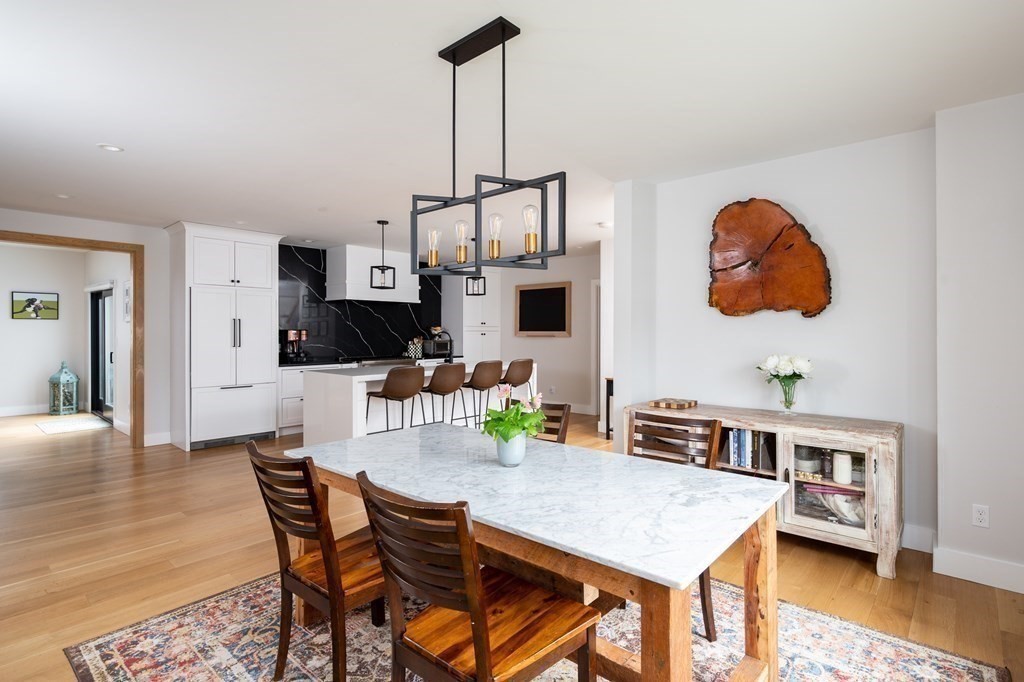 100 Gerald Road Milton, MA 02186 - Photo 17 of 42 a view of a dining room with furniture and wooden floor
