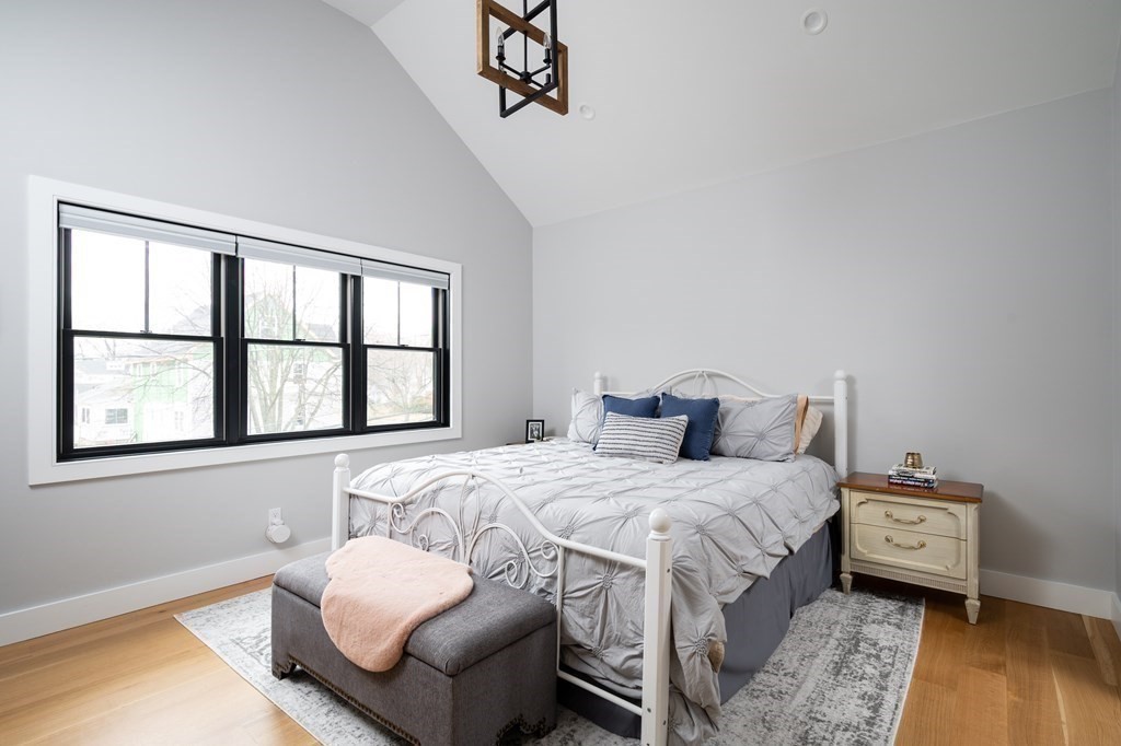 100 Gerald Road Milton, MA 02186 - Photo 27 of 42 a bedroom with a bed and a couch