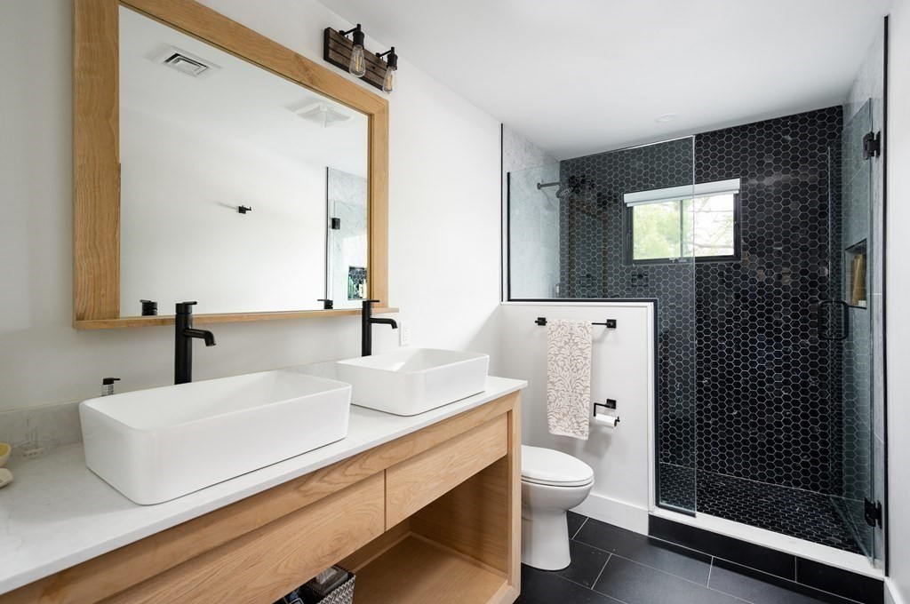 100 Gerald Road Milton, MA 02186 - Photo 29 of 42 a bathroom with a sink a toilet and shower
