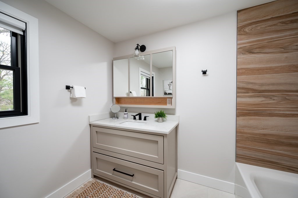 100 Gerald Road Milton, MA 02186 - Photo 32 of 42 a bathroom with a sink toilet and mirror