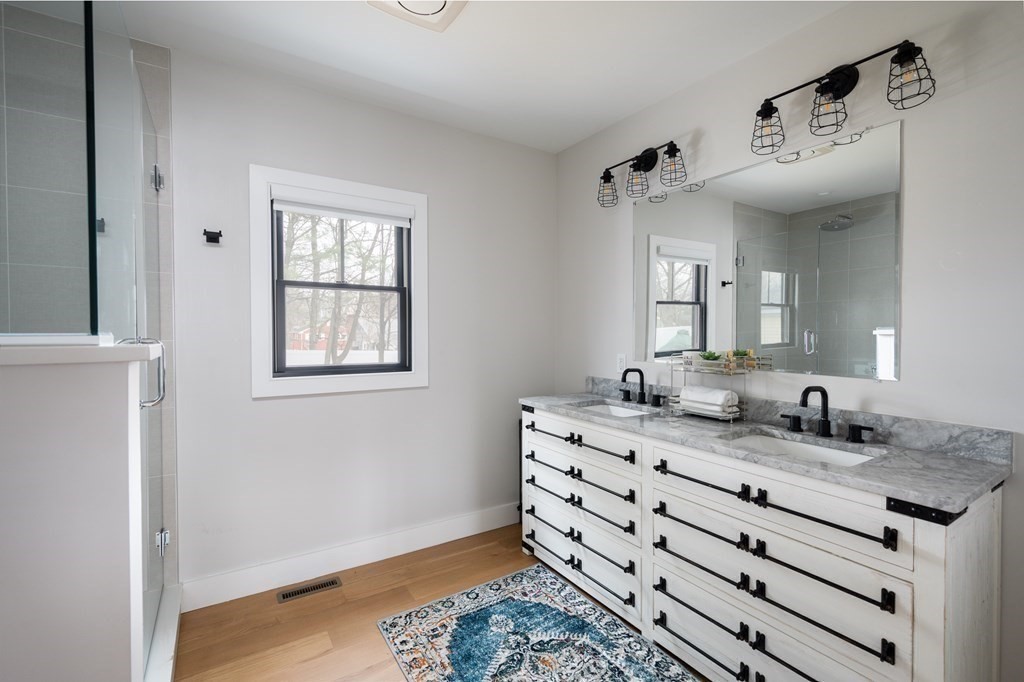 100 Gerald Road Milton, MA 02186 - Photo 36 of 42 a bathroom with a sink and a mirror