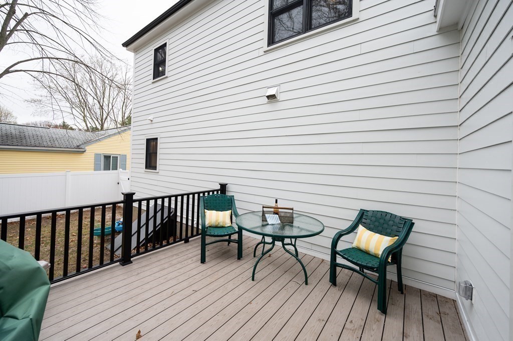 100 Gerald Road Milton, MA 02186 - Photo 38 of 42 a view of a wooden bench on the deck