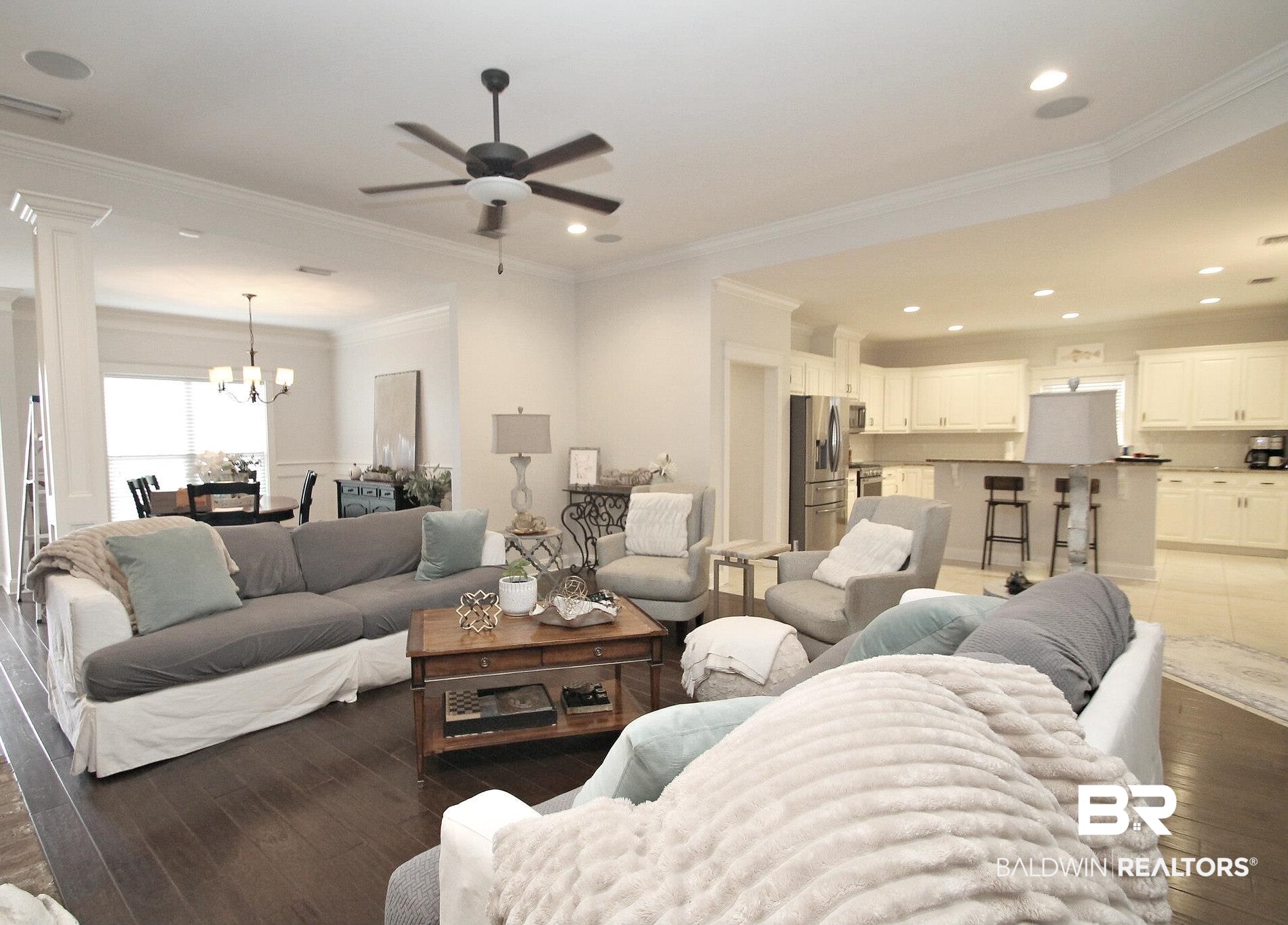 30232 Persimmon Drive Daphne, AL 36527 - Photo 4 of 27 Living area featuring visible vents, dark wood finished floors, crown molding, and recessed lighting