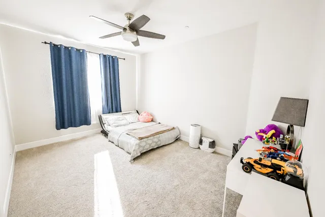 a bathroom with a granite countertop sink a mirror and a shower