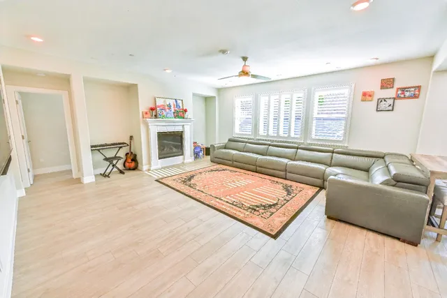 a spacious bathroom with a double vanity sink mirror and next to a window