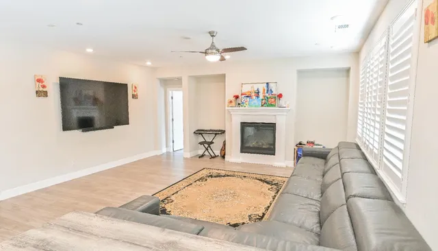 a bathroom with a double vanity sink a mirror and a bathtub