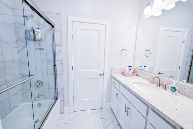 a kitchen with a table chairs sink and cabinets
