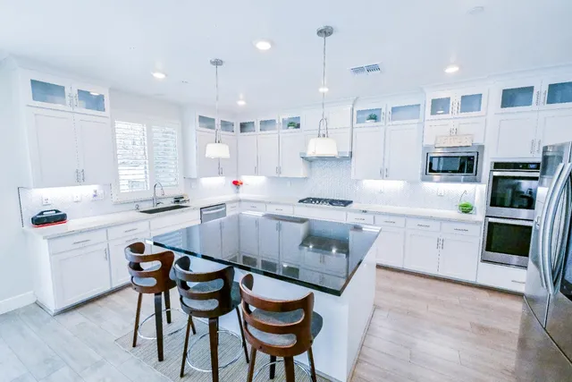 a bathroom with a sink toilet and mirror