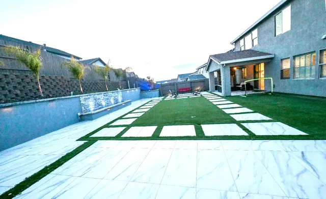 a view of a living room with furniture and a chandelier
