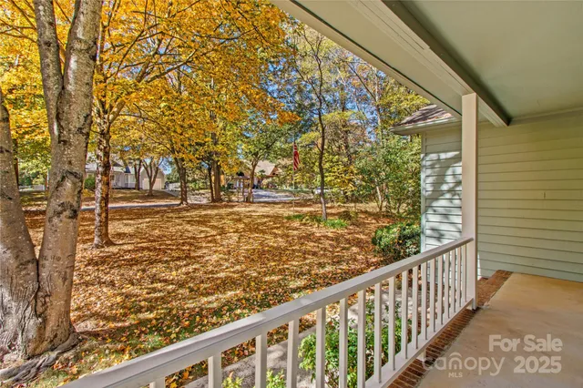 a view of a hallway with wooden floor and entryway