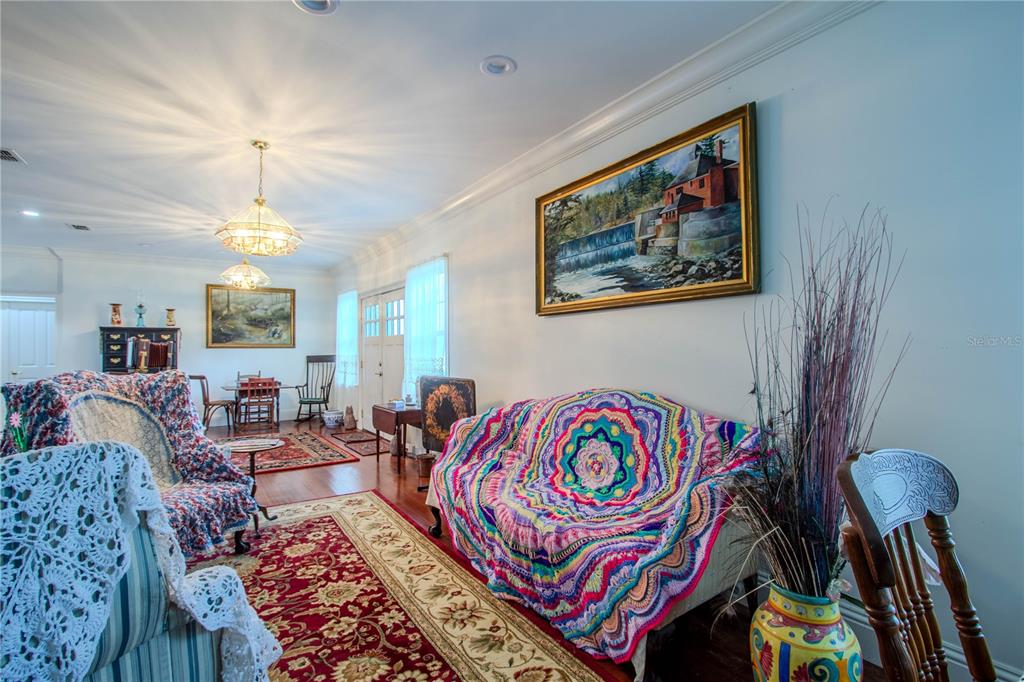 500 South Fort Christmas Road Christmas, FL 32709 - Photo 16 of 25 a living room with furniture and a chandelier
