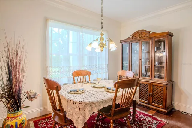 a view of a dining room with furniture window and outside view