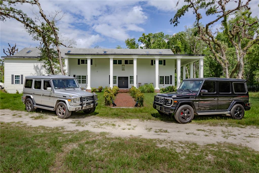 500 South Fort Christmas Road Christmas, FL 32709 - Photo 3 of 25 a view of a car parked in front of a house