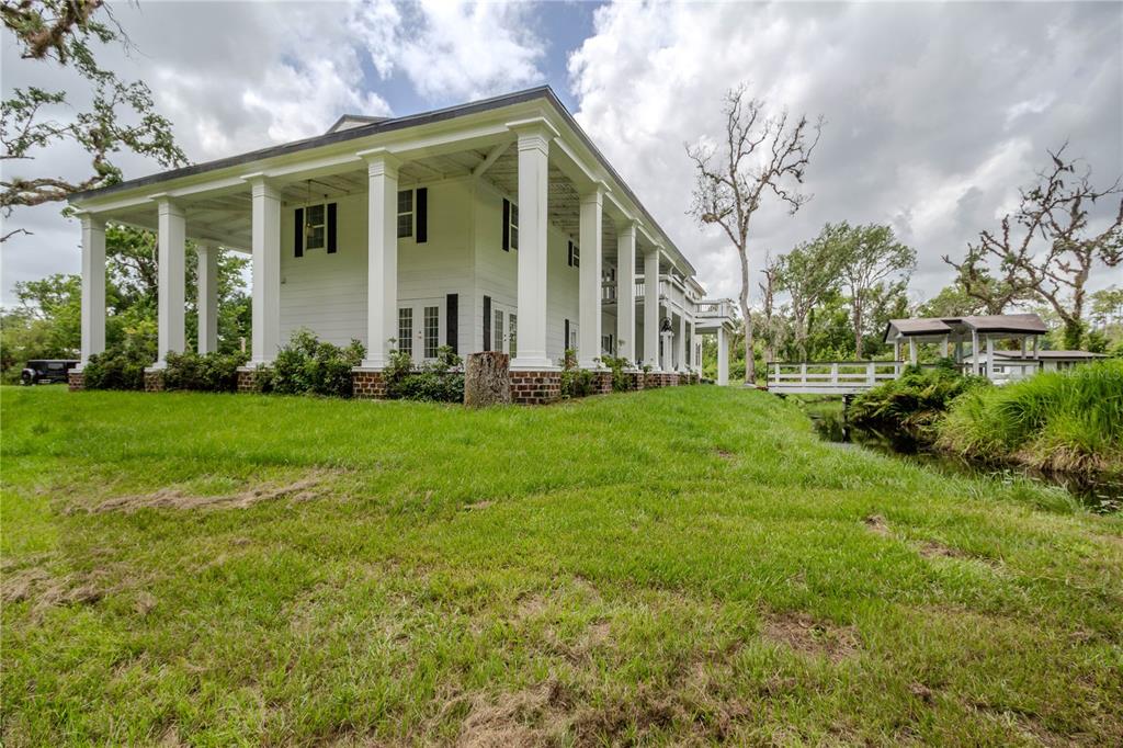500 South Fort Christmas Road Christmas, FL 32709 - Photo 10 of 25 a front view of a house with a yard