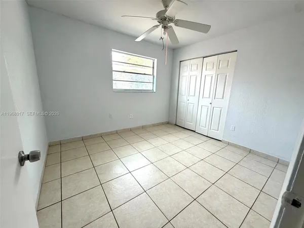 a view of an empty room and window
