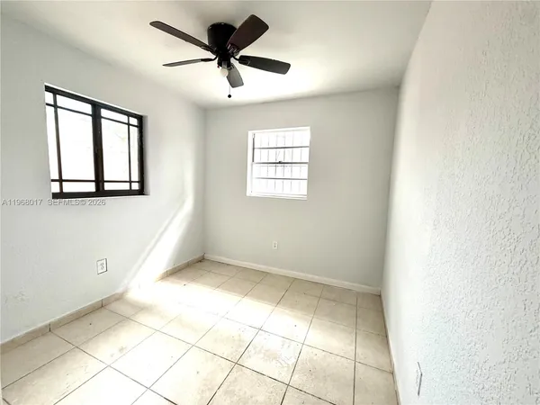 a view of an empty room and window