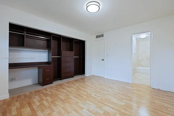 a view of a livingroom with a kitchen