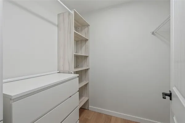 a bedroom with a bed and furniture