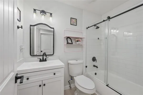 an aerial view of a house with garden space and street view