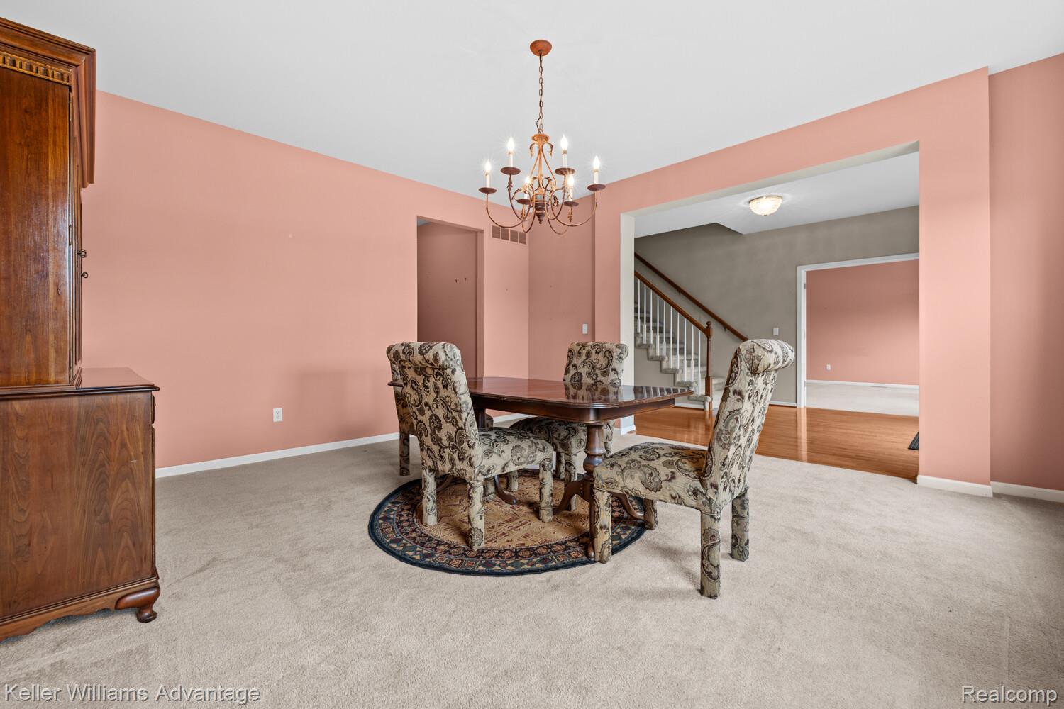 4100 Norwich Court Rochester, MI 48306 - Photo 25 of 72 Dining room featuring light carpet and hanging lights