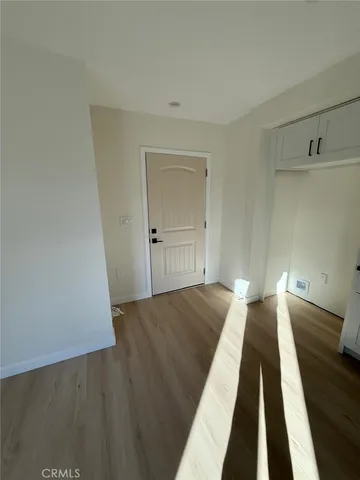 a view of a house with wooden floor and stairs