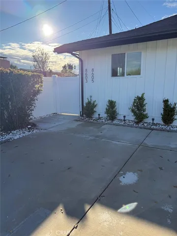 a living room with a bed and furniture
