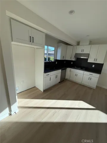 a view of a kitchen with a sink
