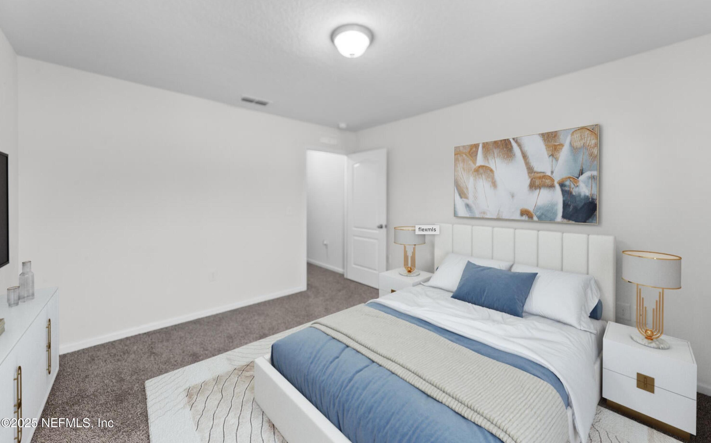 8039 Echo Springs Road Jacksonville, FL 32256 - Photo 11 of 22 a bedroom with a bed and painting on the wall