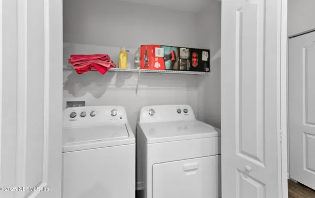 a utility room with dryer and washer