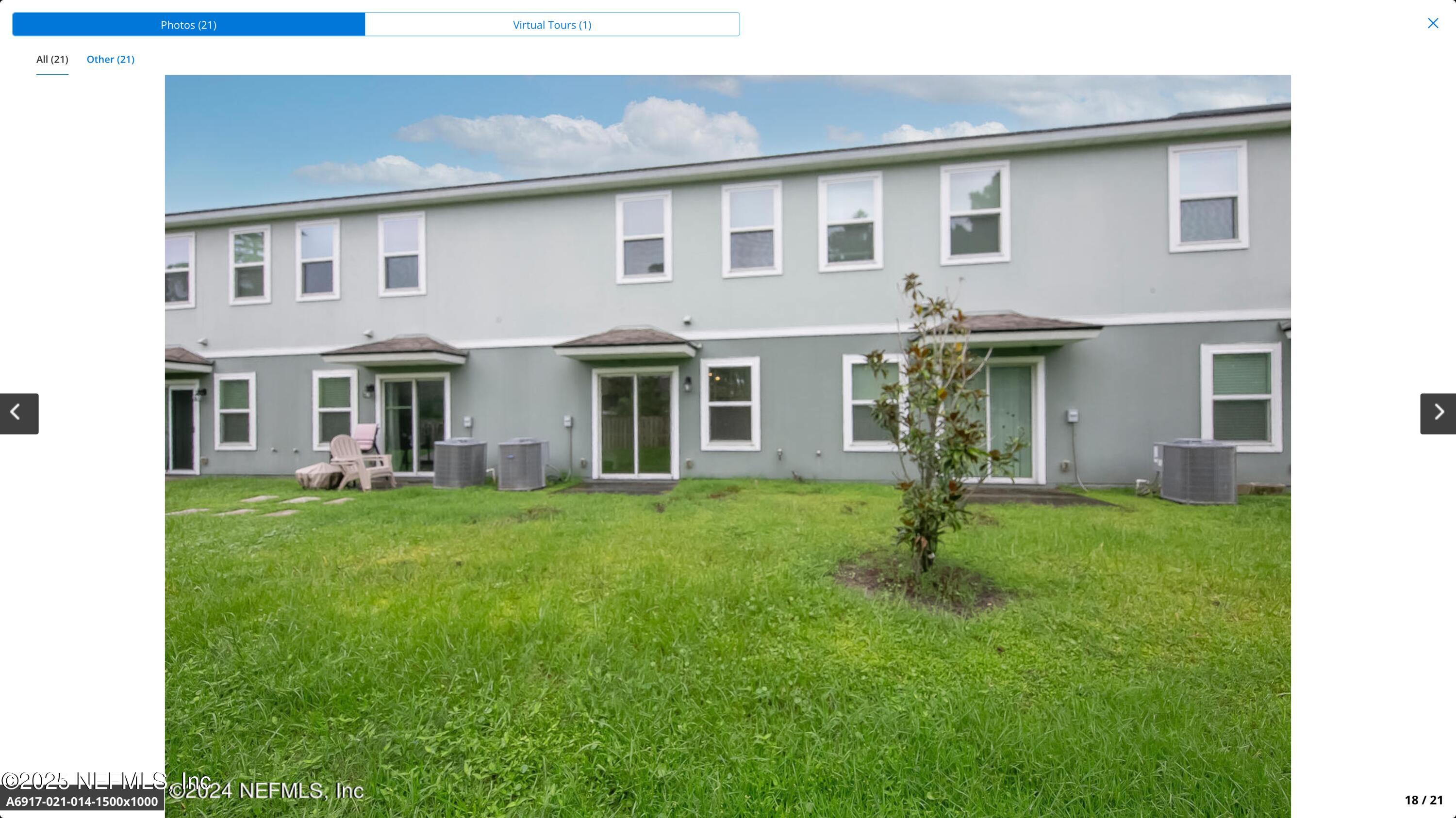 8039 Echo Springs Road Jacksonville, FL 32256 - Photo 18 of 22 a front view of a house with a garden