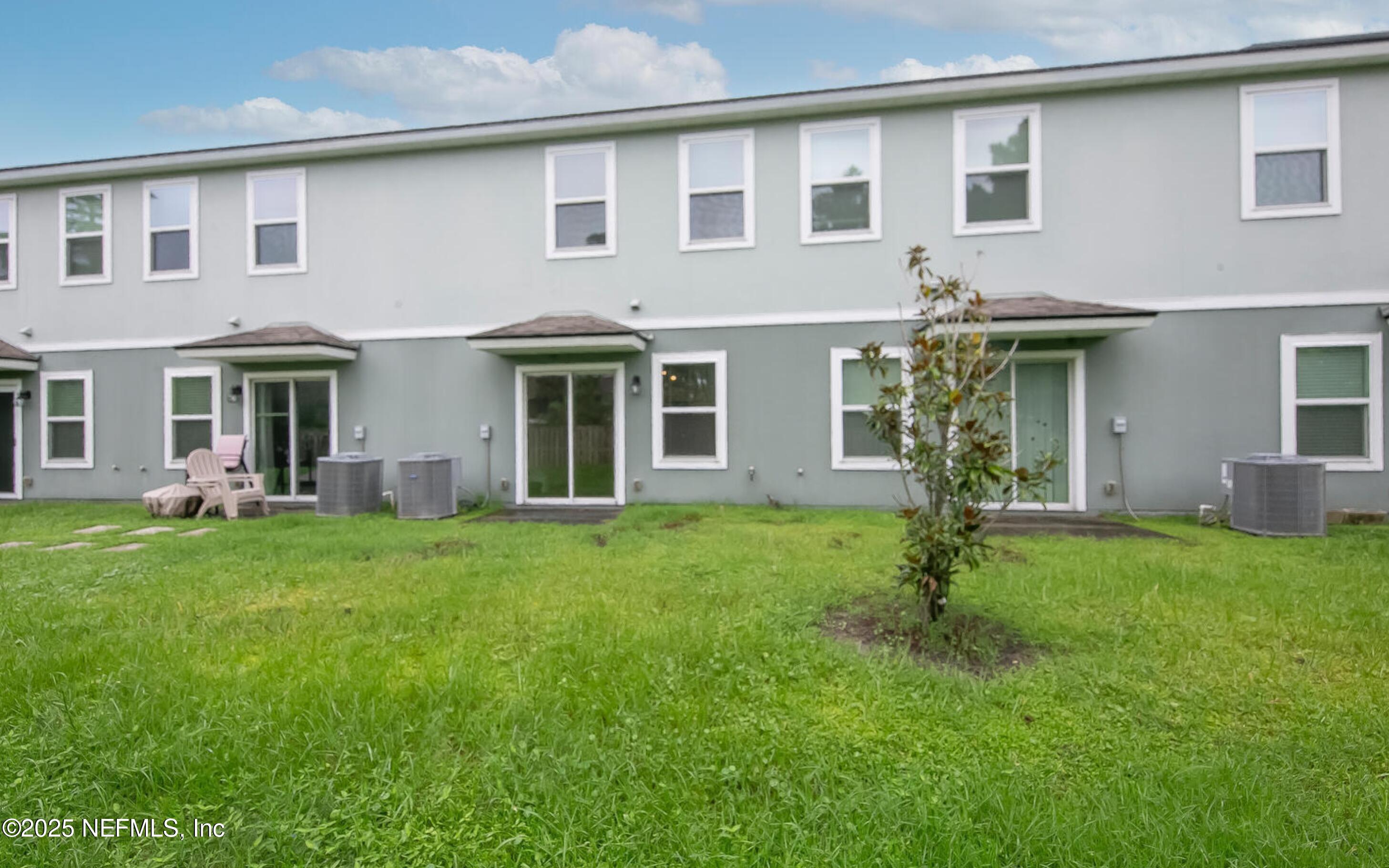 8039 Echo Springs Road Jacksonville, FL 32256 - Photo 19 of 22 front view of a house with a yard