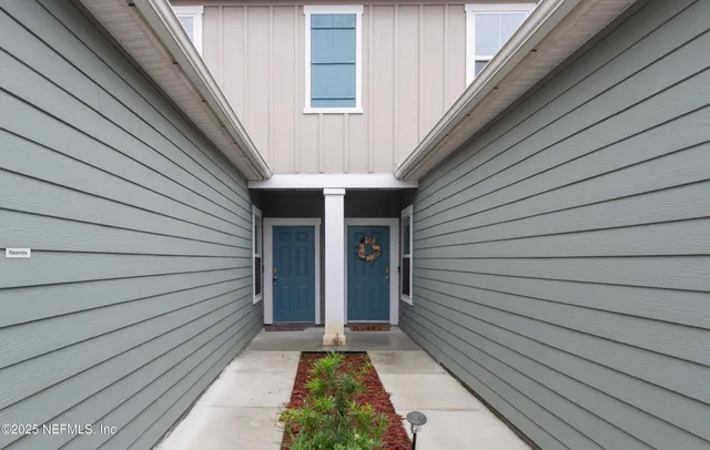 a view of house with backyard