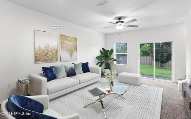 a living room with furniture and a large window