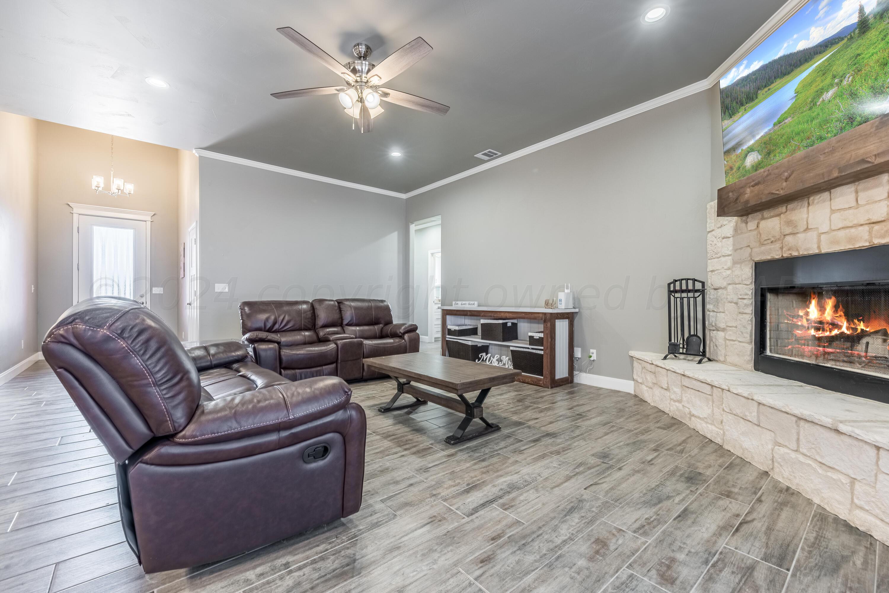 5 Gimball Drive Canyon, TX 79015 - Photo 12 of 36 a living room with furniture and a fireplace