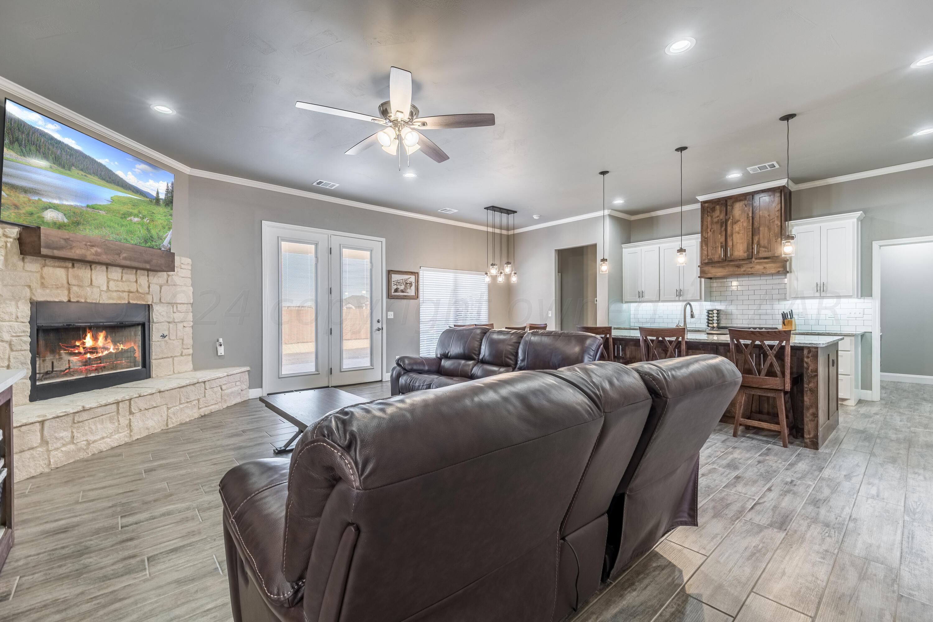 5 Gimball Drive Canyon, TX 79015 - Photo 14 of 36 a living room with furniture and a fireplace