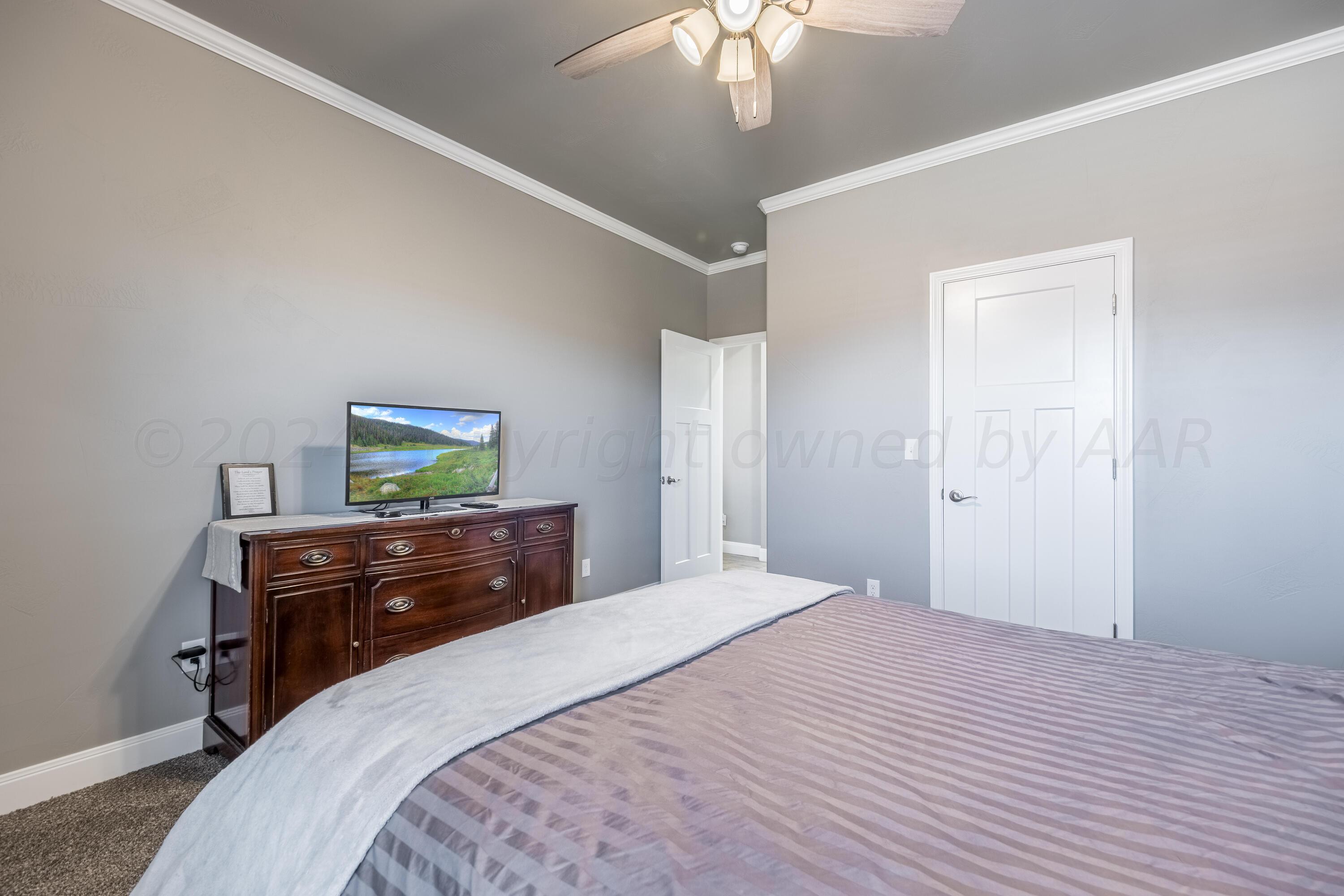 5 Gimball Drive Canyon, TX 79015 - Photo 20 of 36 a bedroom with a bed and a dresser