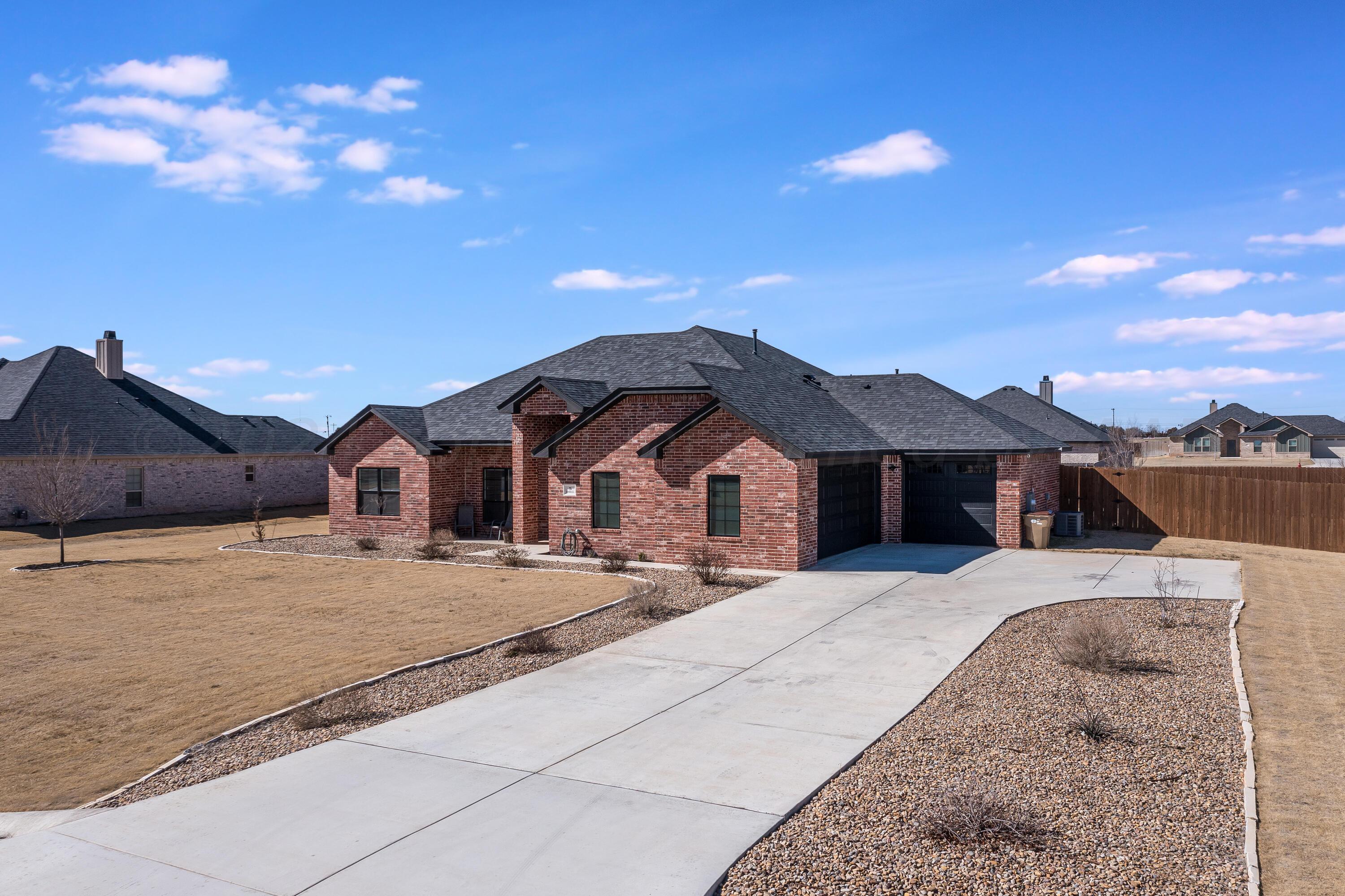 5 Gimball Drive Canyon, TX 79015 - Photo 2 of 36 a front view of a house with a yard