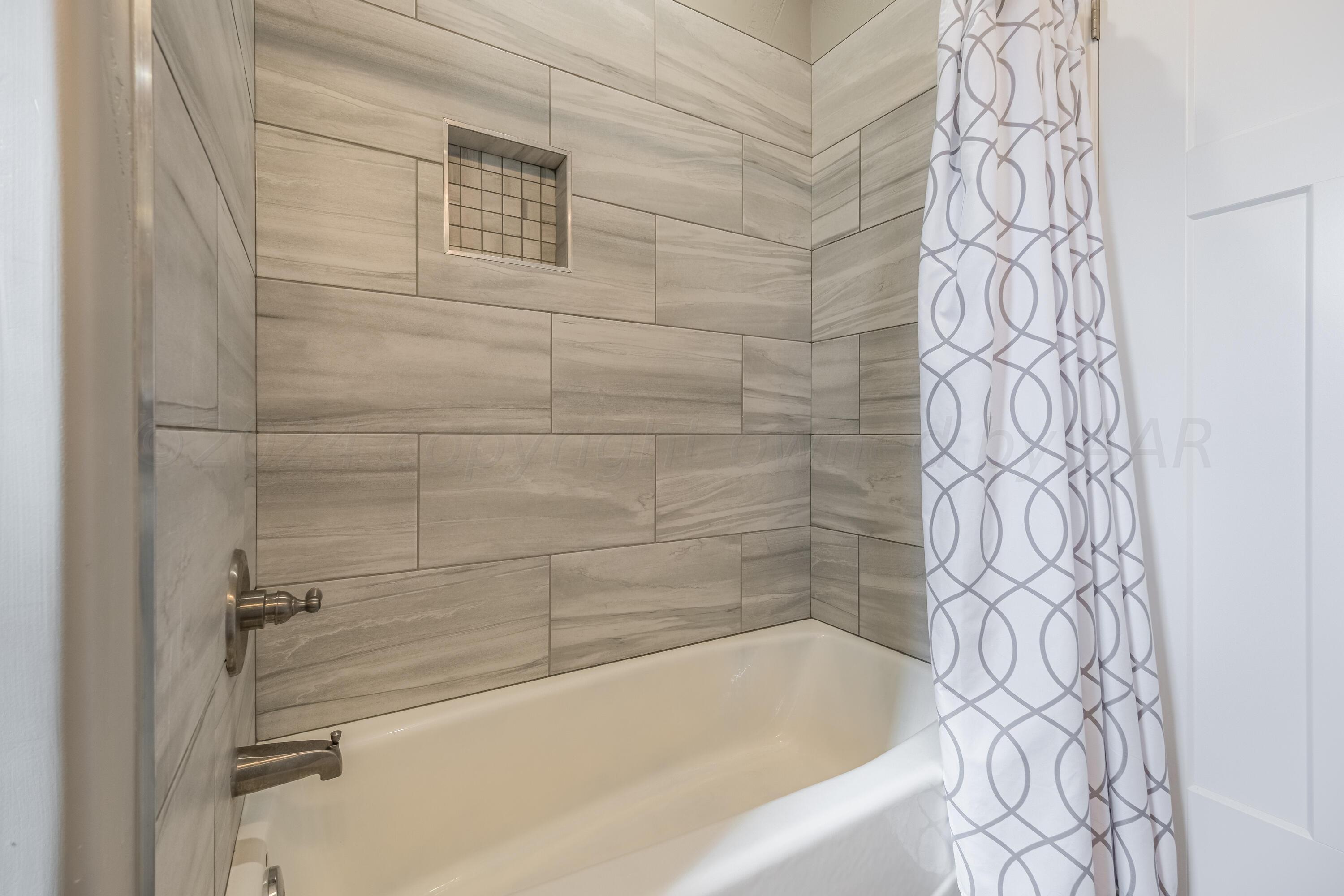 5 Gimball Drive Canyon, TX 79015 - Photo 23 of 36 a bathroom with a bathtub and shower