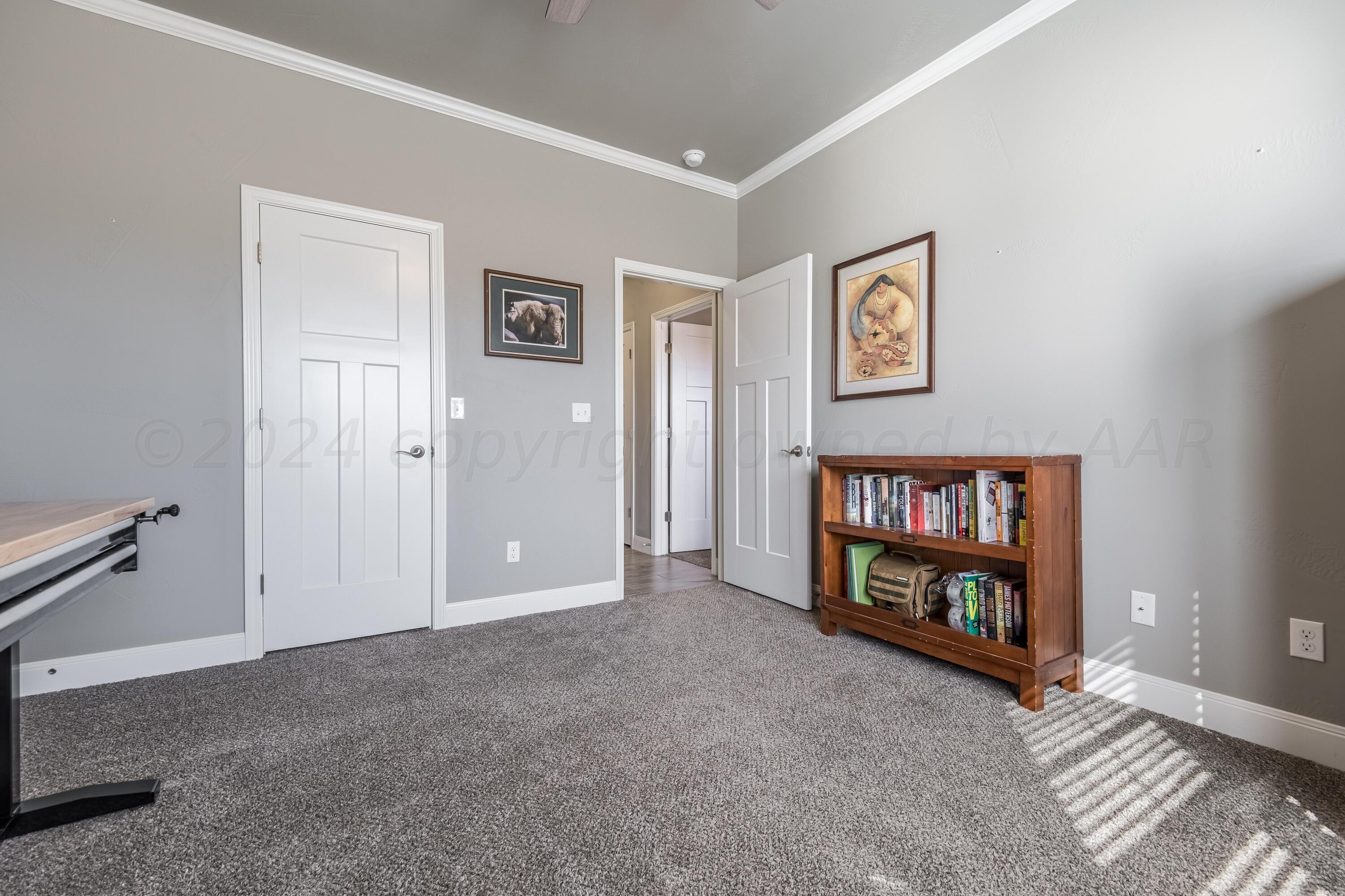 5 Gimball Drive Canyon, TX 79015 - Photo 25 of 36 a view of an empty room with window and a flat screen tv