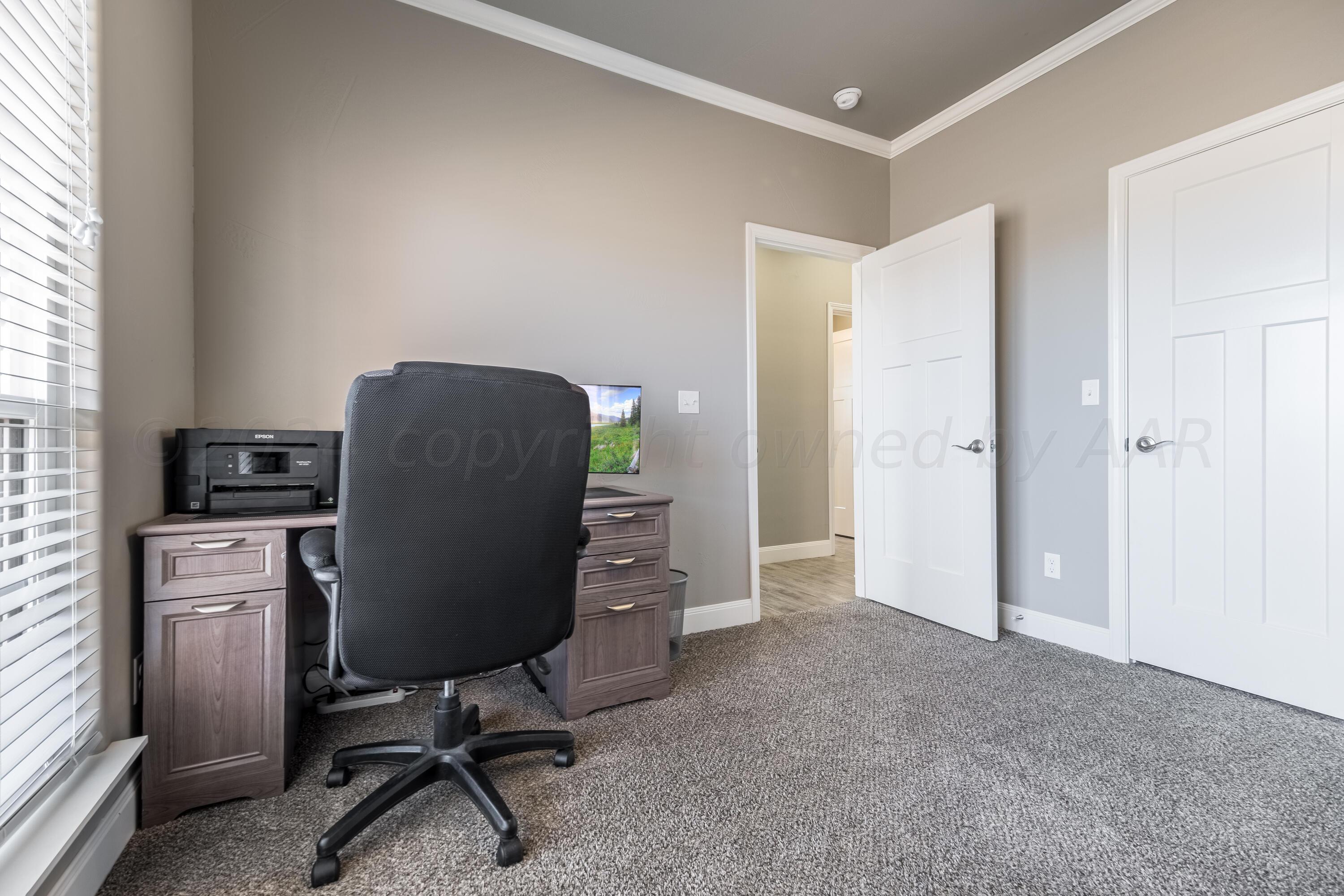 5 Gimball Drive Canyon, TX 79015 - Photo 27 of 36 a view of a workspace with furniture and a window
