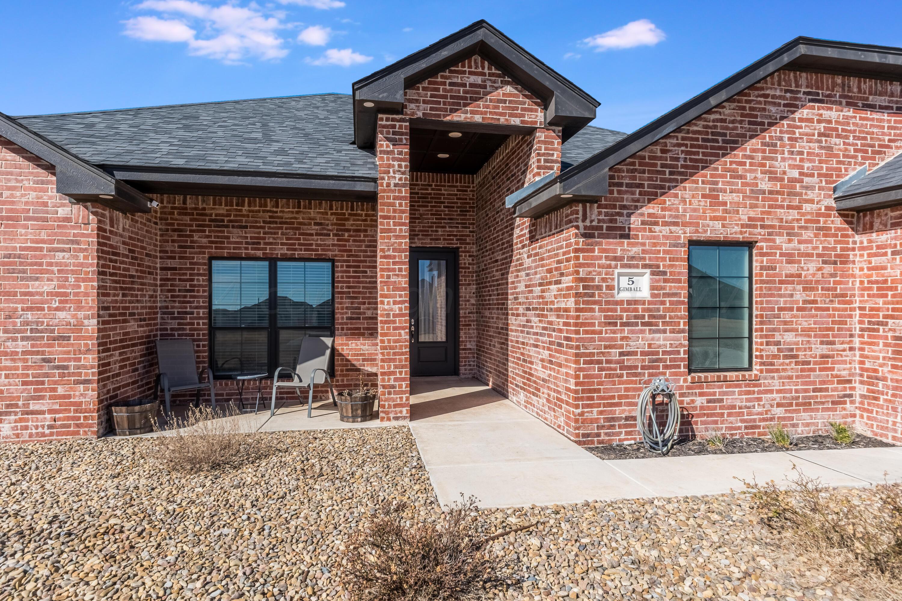 5 Gimball Drive Canyon, TX 79015 - Photo 34 of 36 a front view of a house with a yard