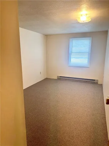 a bathroom with a toilet and a bathtub