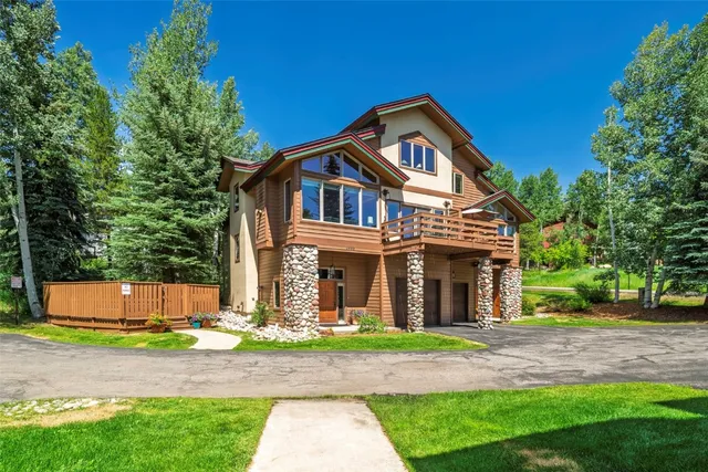 a bedroom with a bed a dresser and chair