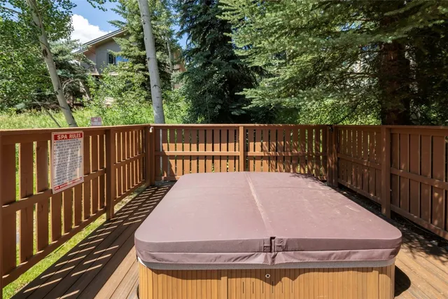 a view of a house with a wooden deck