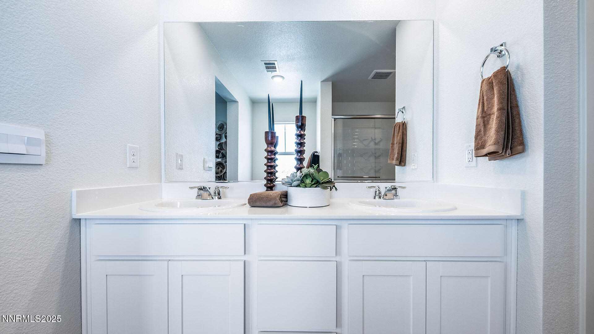 7836 Lazy Stream Drive, Unit 151 Reno, NV 89506 - Photo 17 of 25 a bathroom with double sink and a mirror