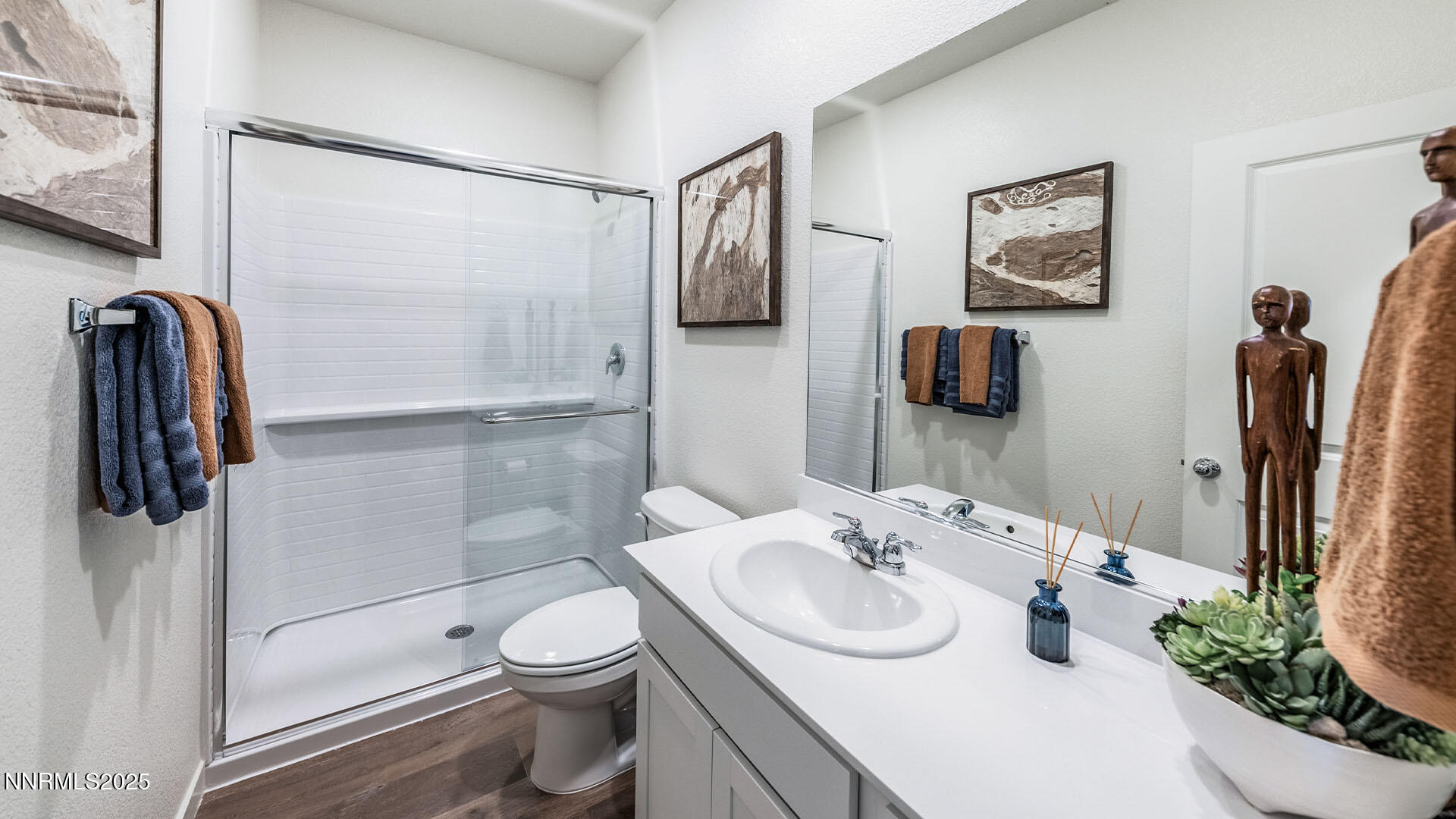 7836 Lazy Stream Drive, Unit 151 Reno, NV 89506 - Photo 21 of 25 a bathroom with a granite countertop sink a toilet and shower
