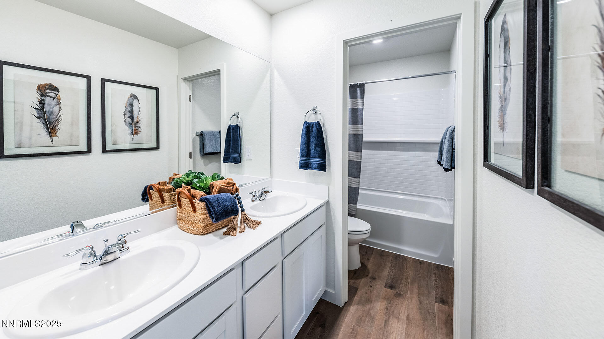 7836 Lazy Stream Drive, Unit 151 Reno, NV 89506 - Photo 23 of 25 a bathroom with a double vanity sink and a mirror