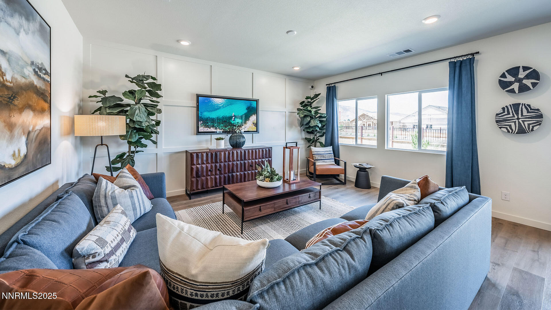 7836 Lazy Stream Drive, Unit 151 Reno, NV 89506 - Photo 9 of 25 a living room with furniture a window and a flat screen tv