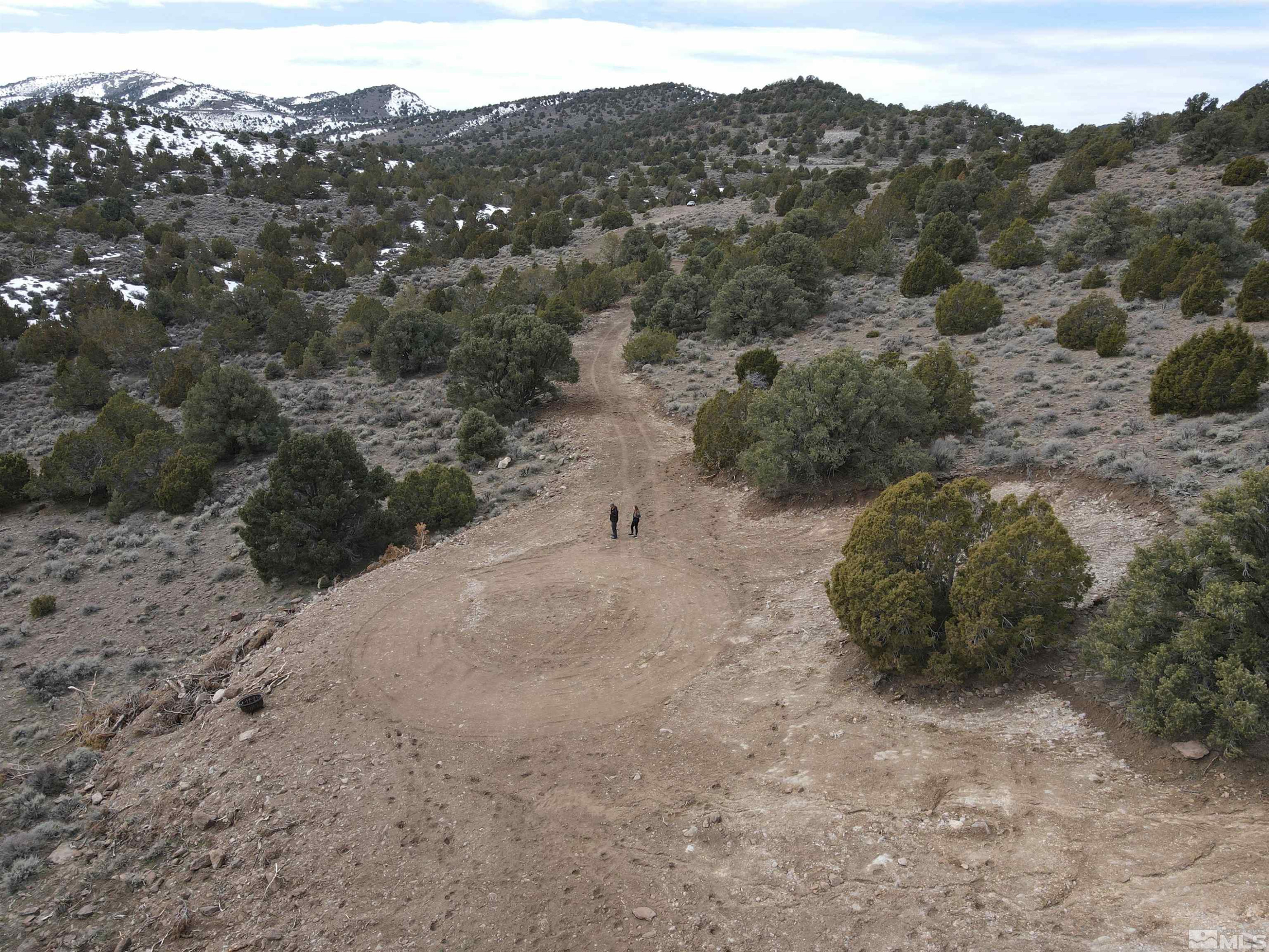 4490 Lousetown Road Reno, NV 89521 - Photo 6 of 11 a view of a dry field with mountains in the background